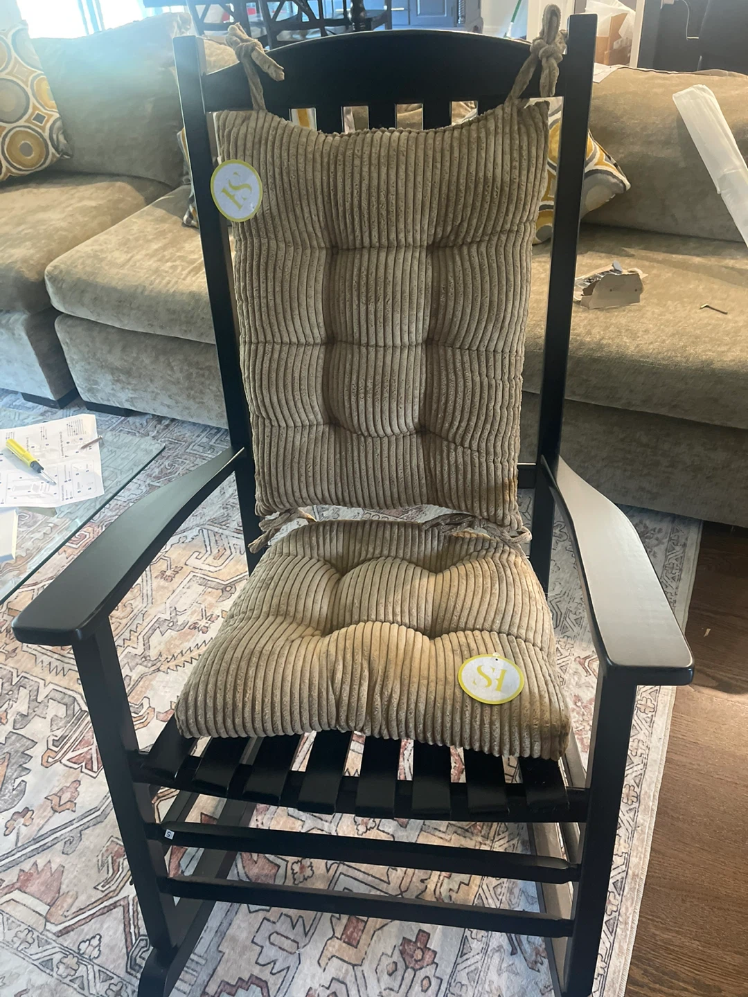 Black Wooden Rocking Chair with chair cushion.