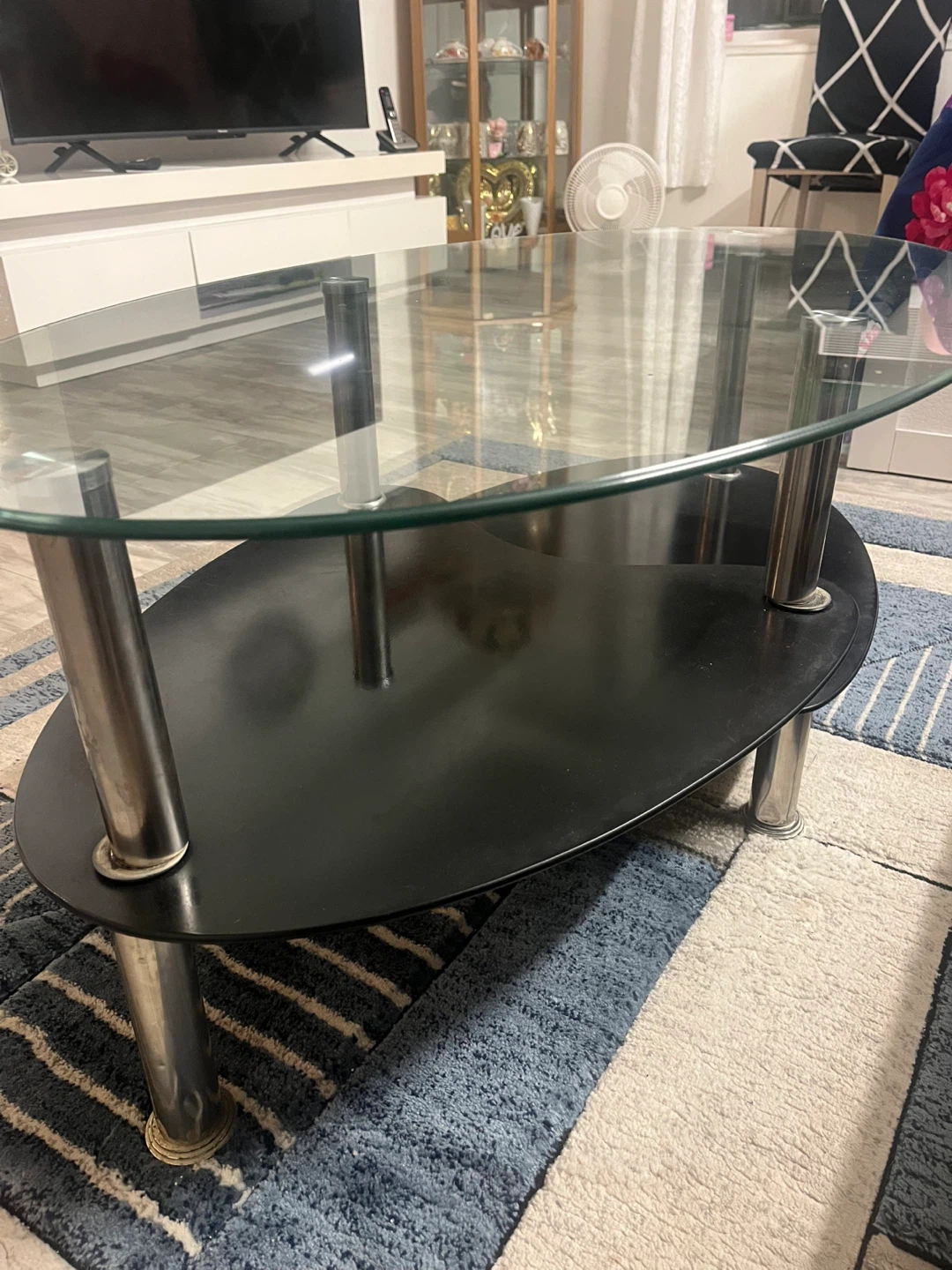 Glass and Black Oval Coffee Table