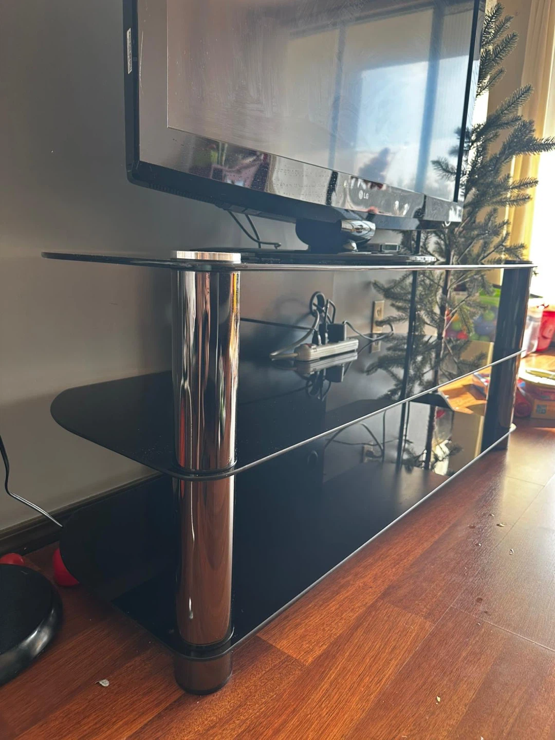 MOVING OUT SALE Black Glass TV Stand with Chrome Legs include TV - photo 3