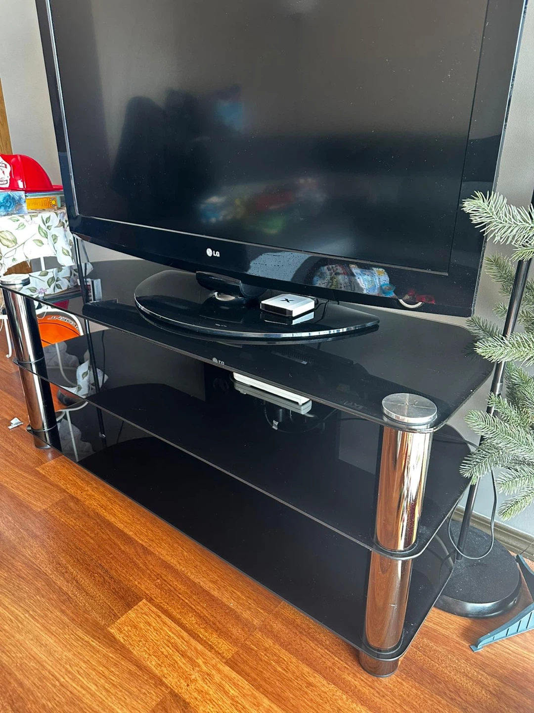 MOVING OUT SALE Black Glass TV Stand with Chrome Legs include TV - photo 2