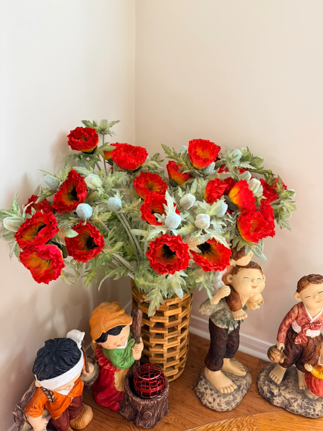 Red flowers deco and wooden vase