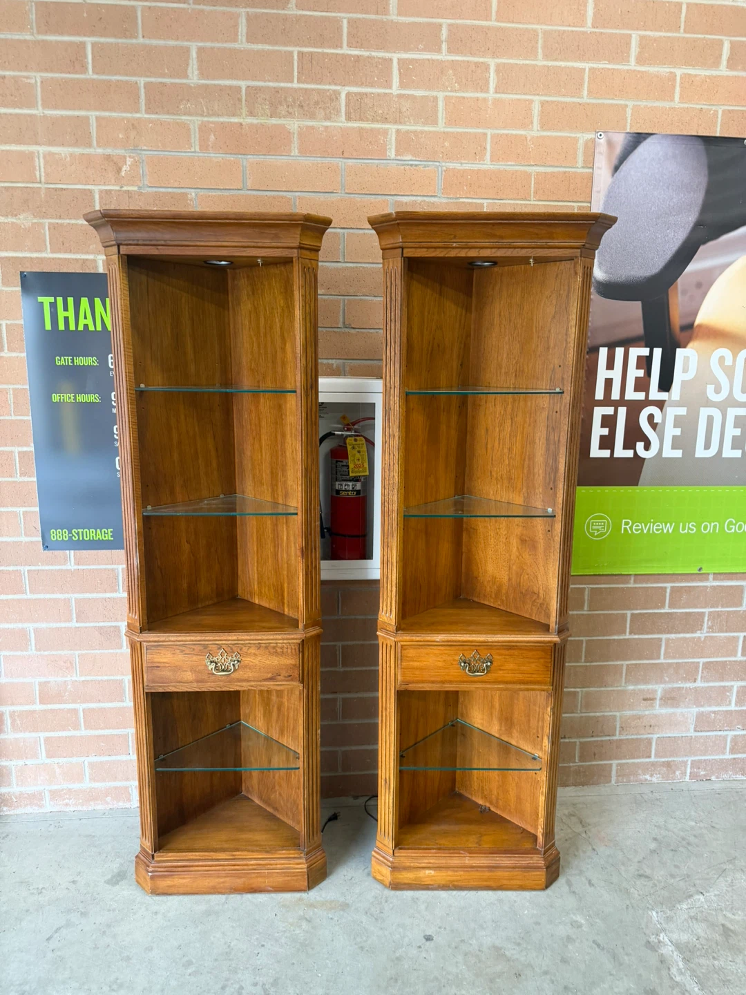 Two Wooden Corner Display Cabinets with Glass Shelves