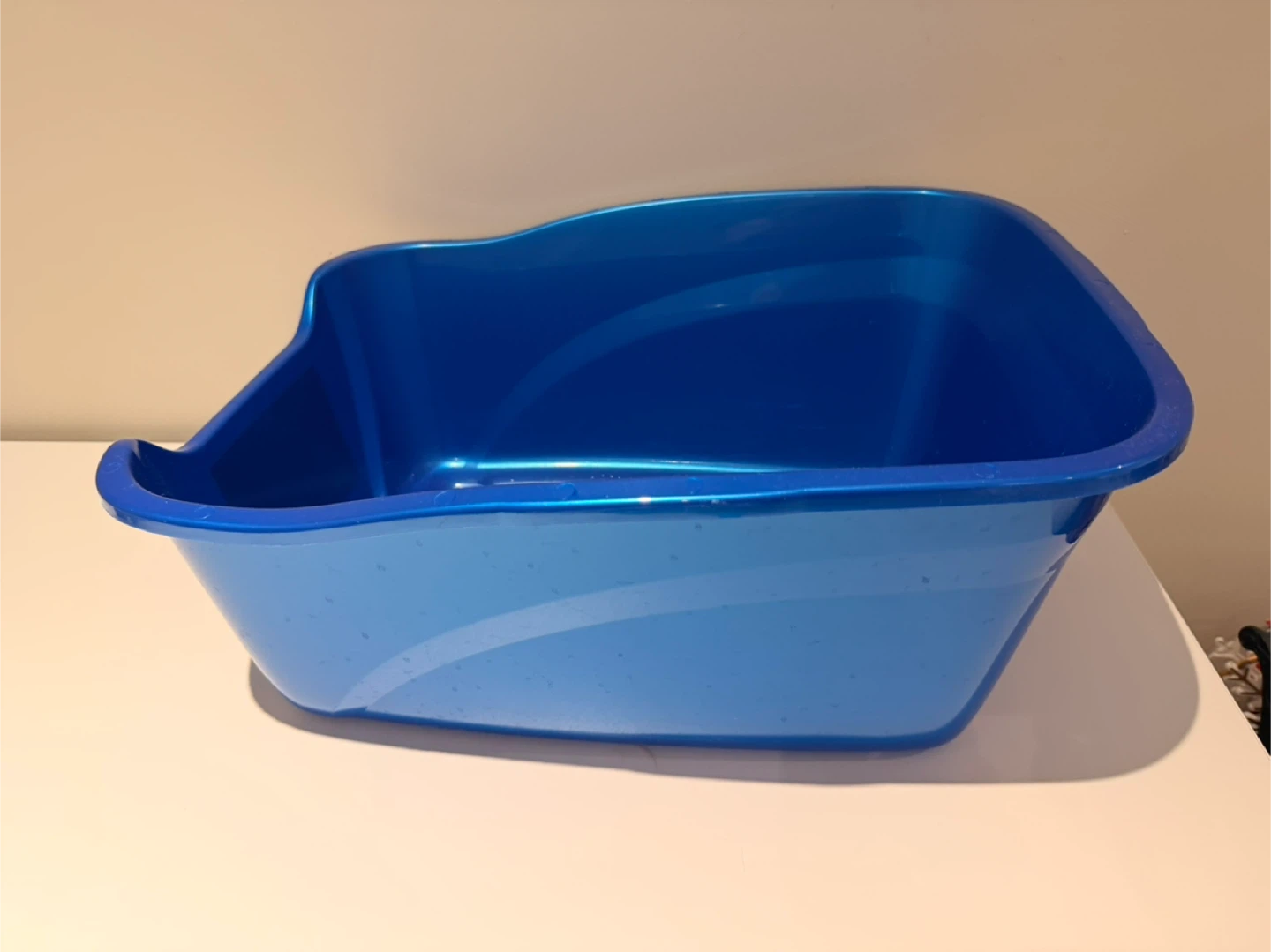 Used plastic cat litter box