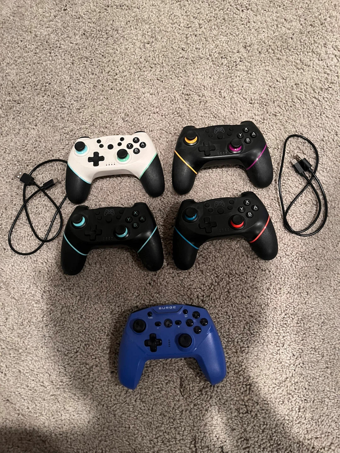 Nintendo Switch Pro Controllers (4 Black, 1 White, 1 Blue)