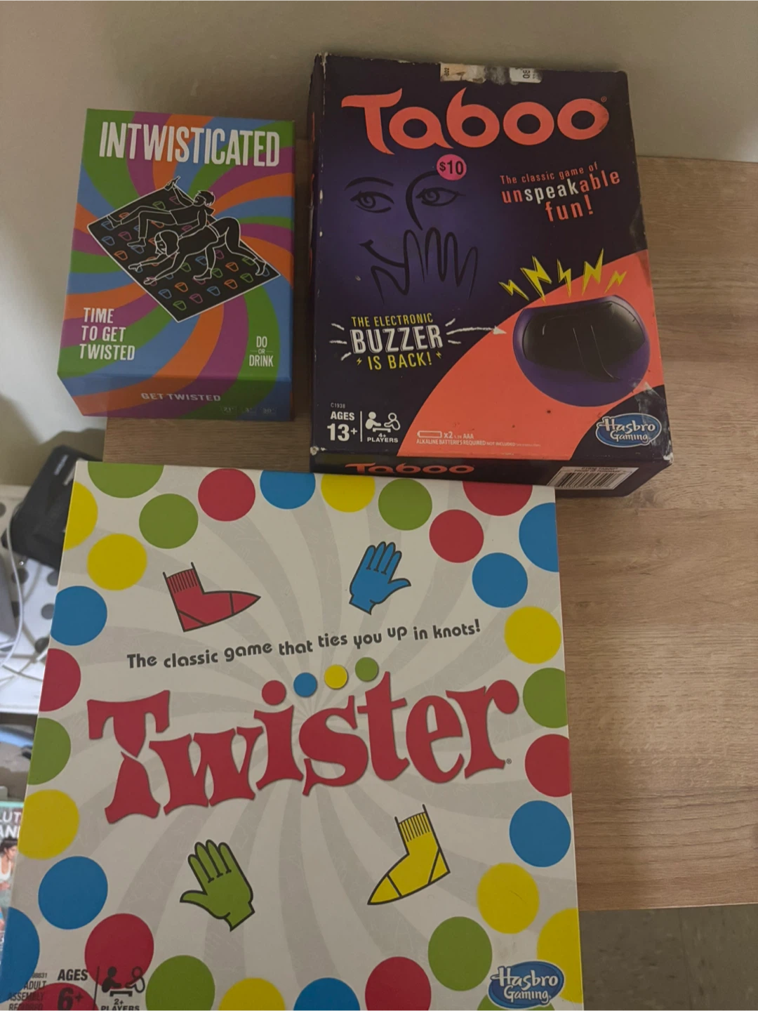 Hasbro Gaming Taboo, Twister, and Intwisticated Party Games