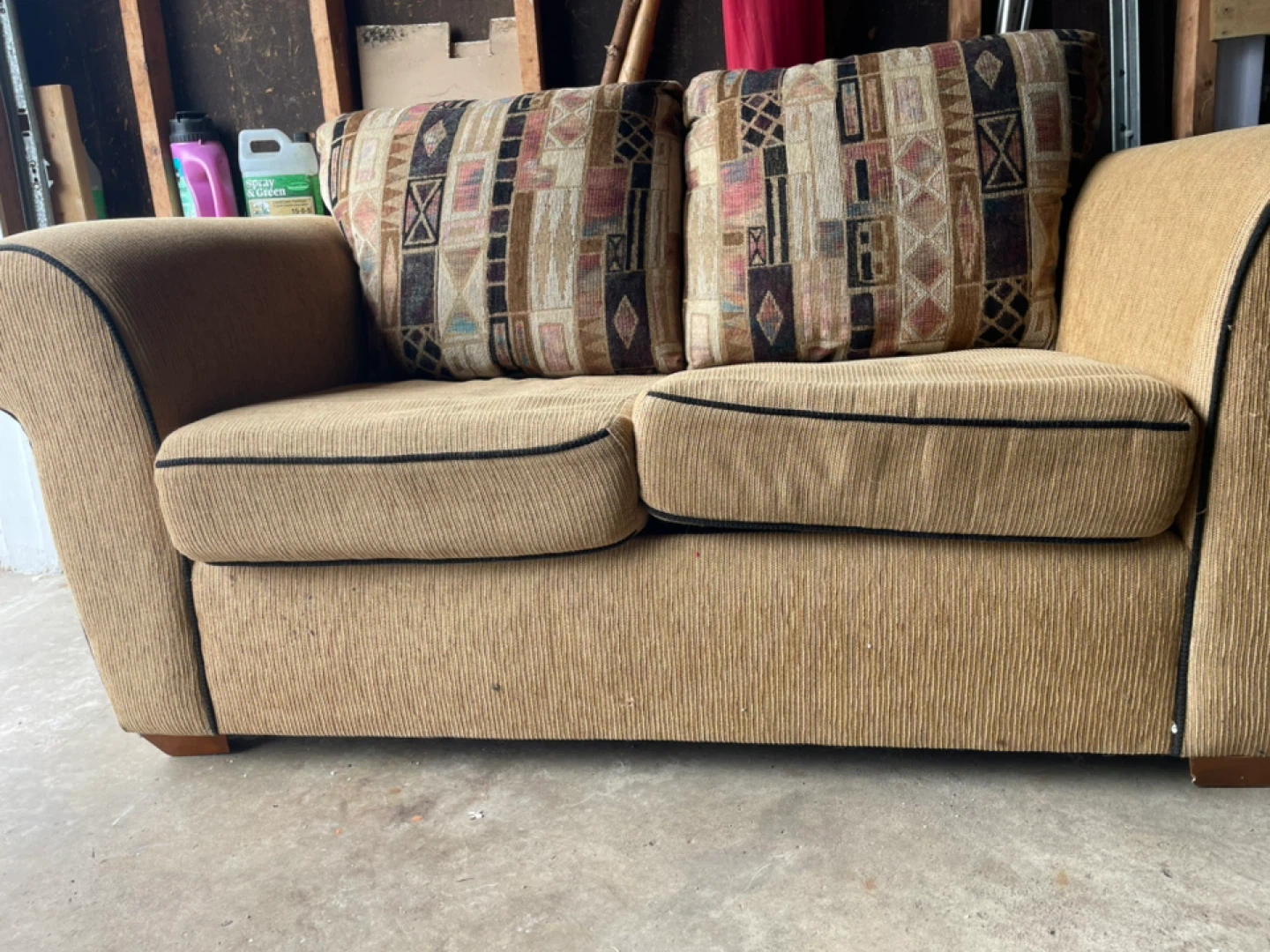 Tan Loveseat Sofa with Geometric Throw Pillows