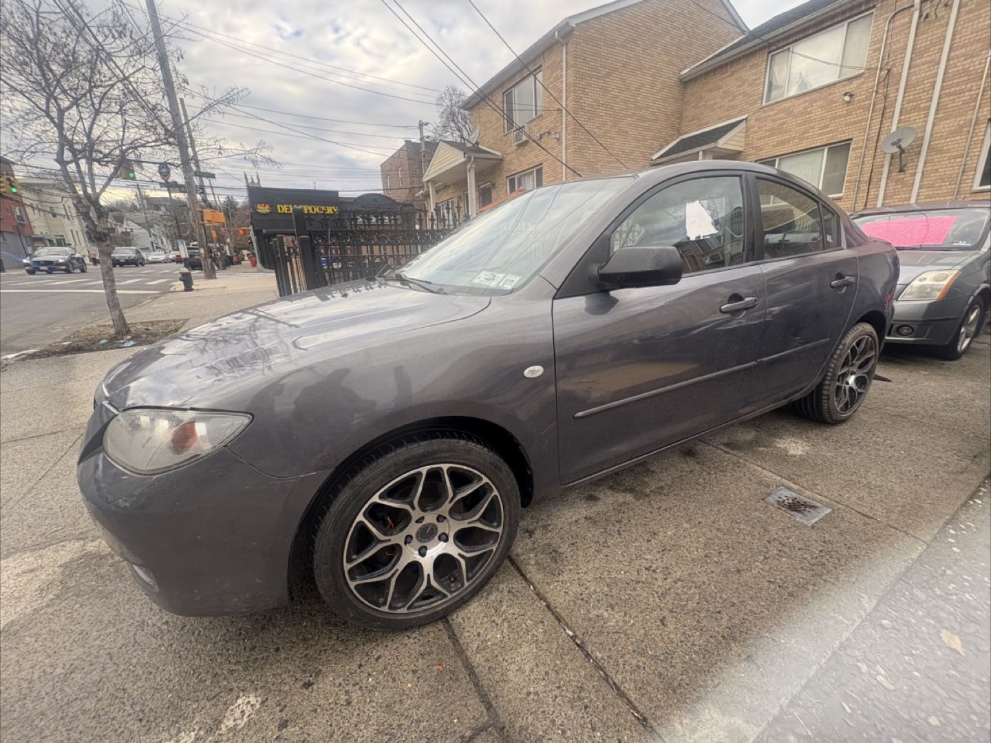 Gray Mazda 3 Sedan