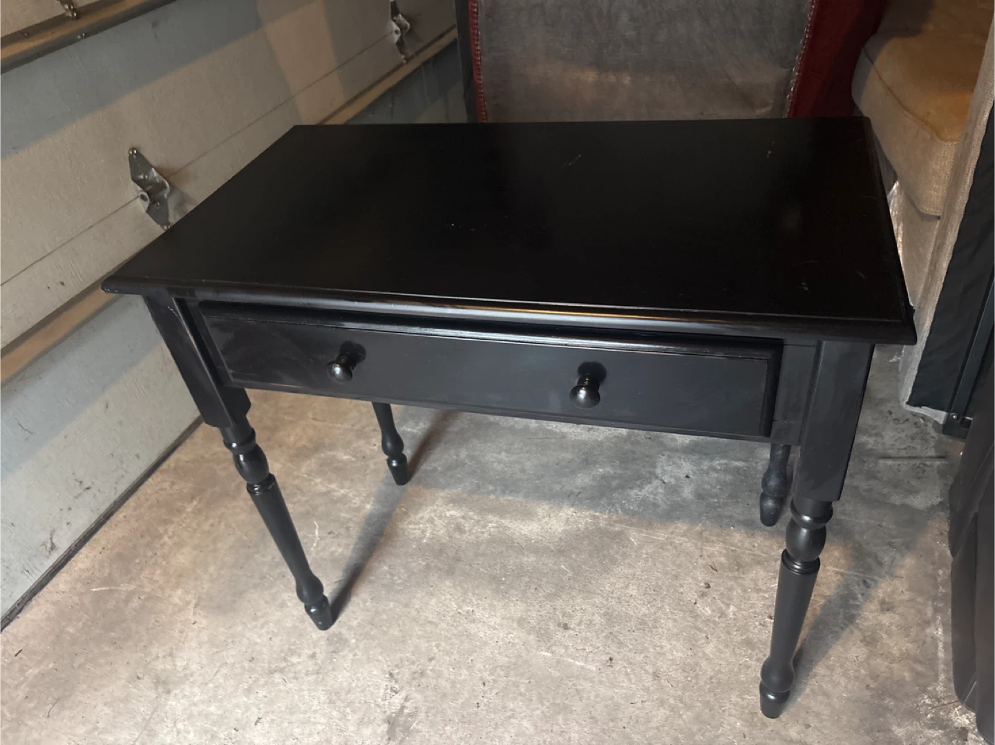 Used Wood accent table with drawer has scratches