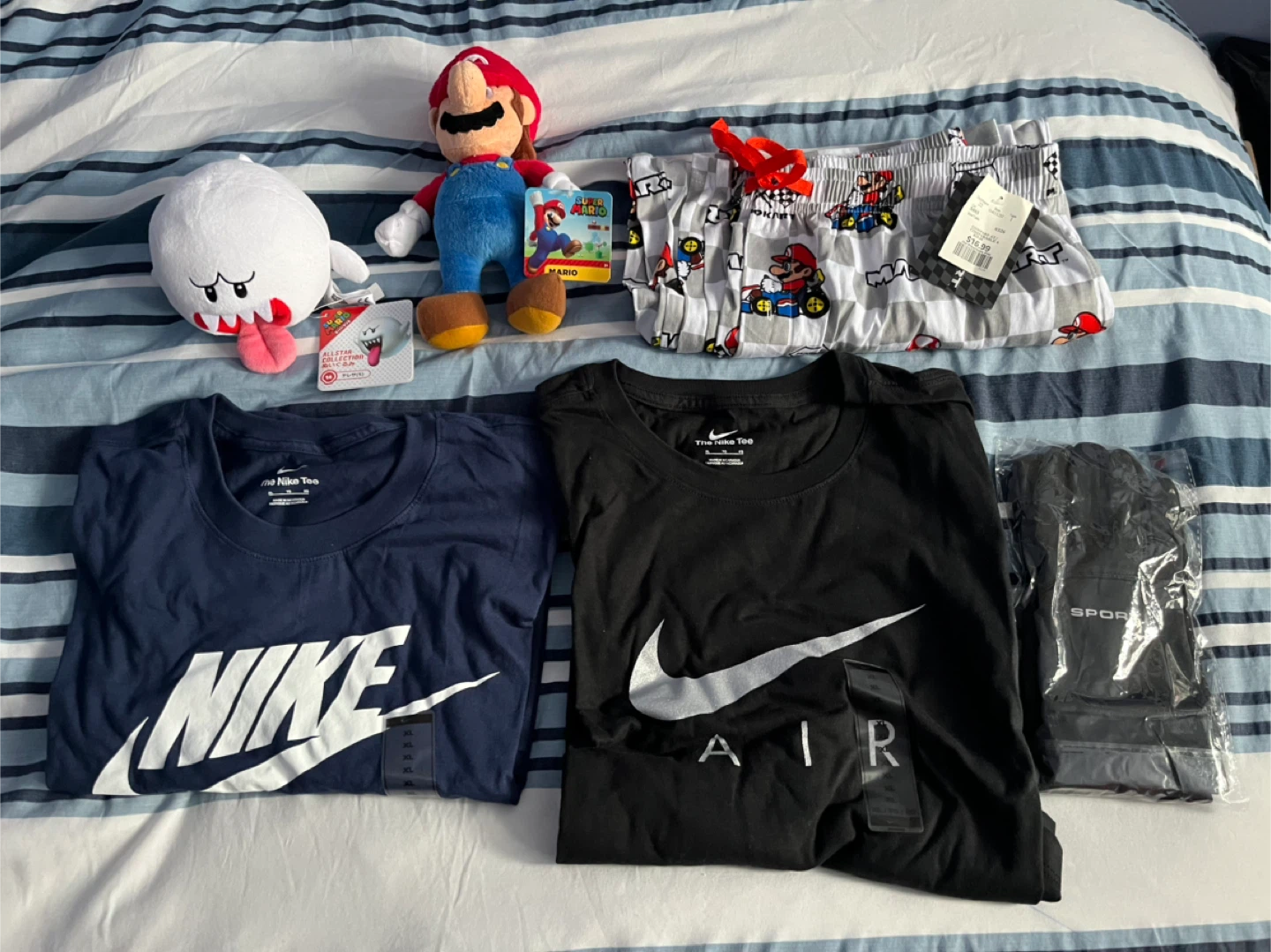Plushies, men’s pj pants, men’s Nike tshirts, and dry fit gloves