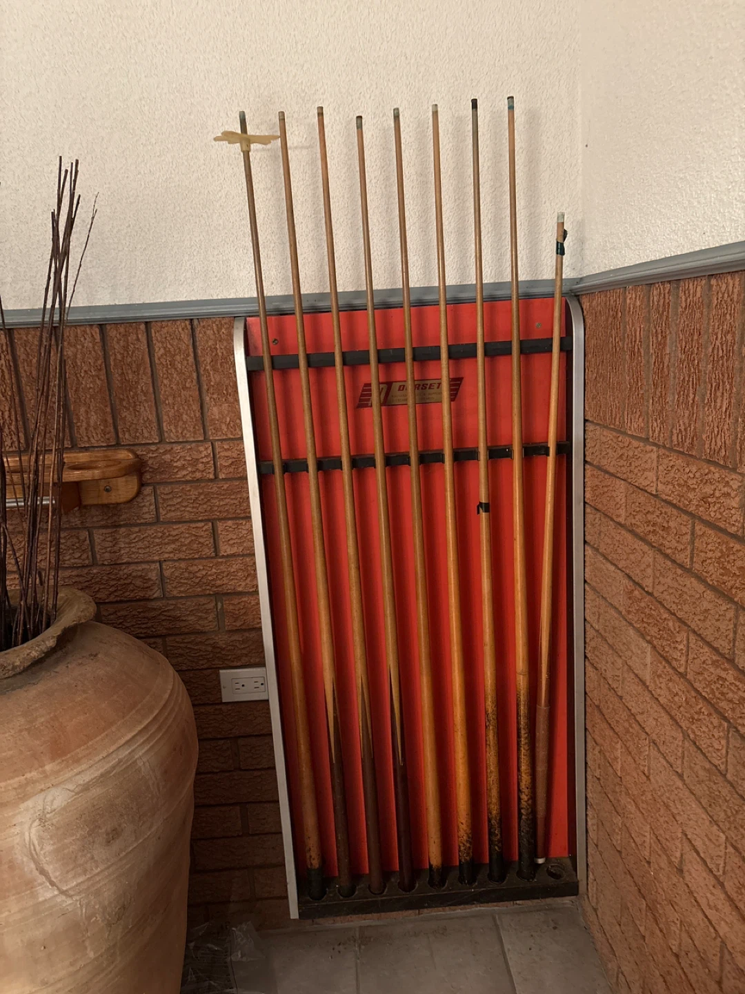 Set of 8 wooden billiard cues with a Dorcet rack
