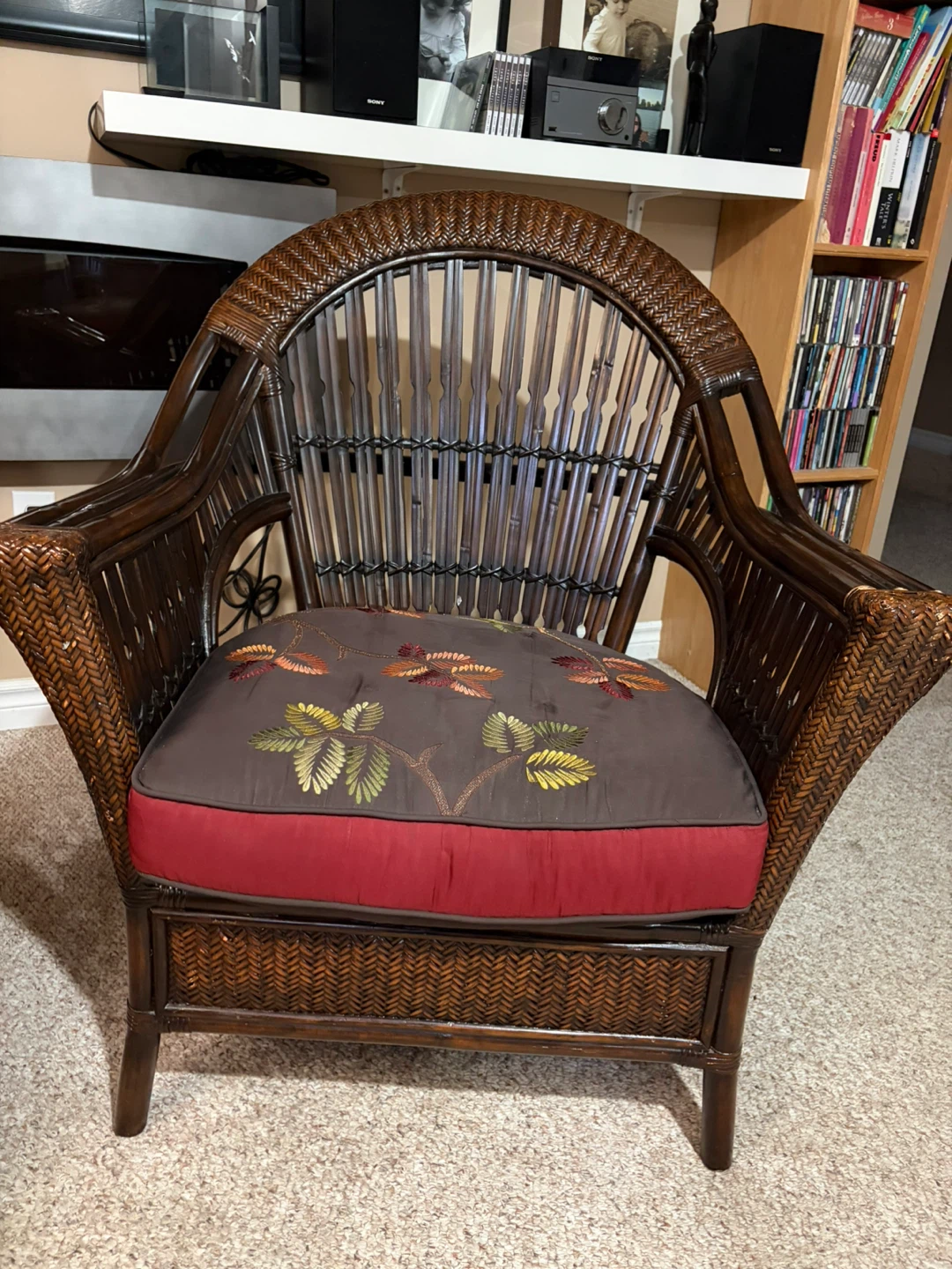 Two Wicker Accent Chairs with Floral Cushions