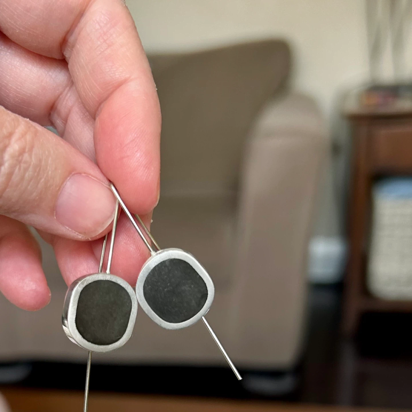 Silver tone earrings with black stones