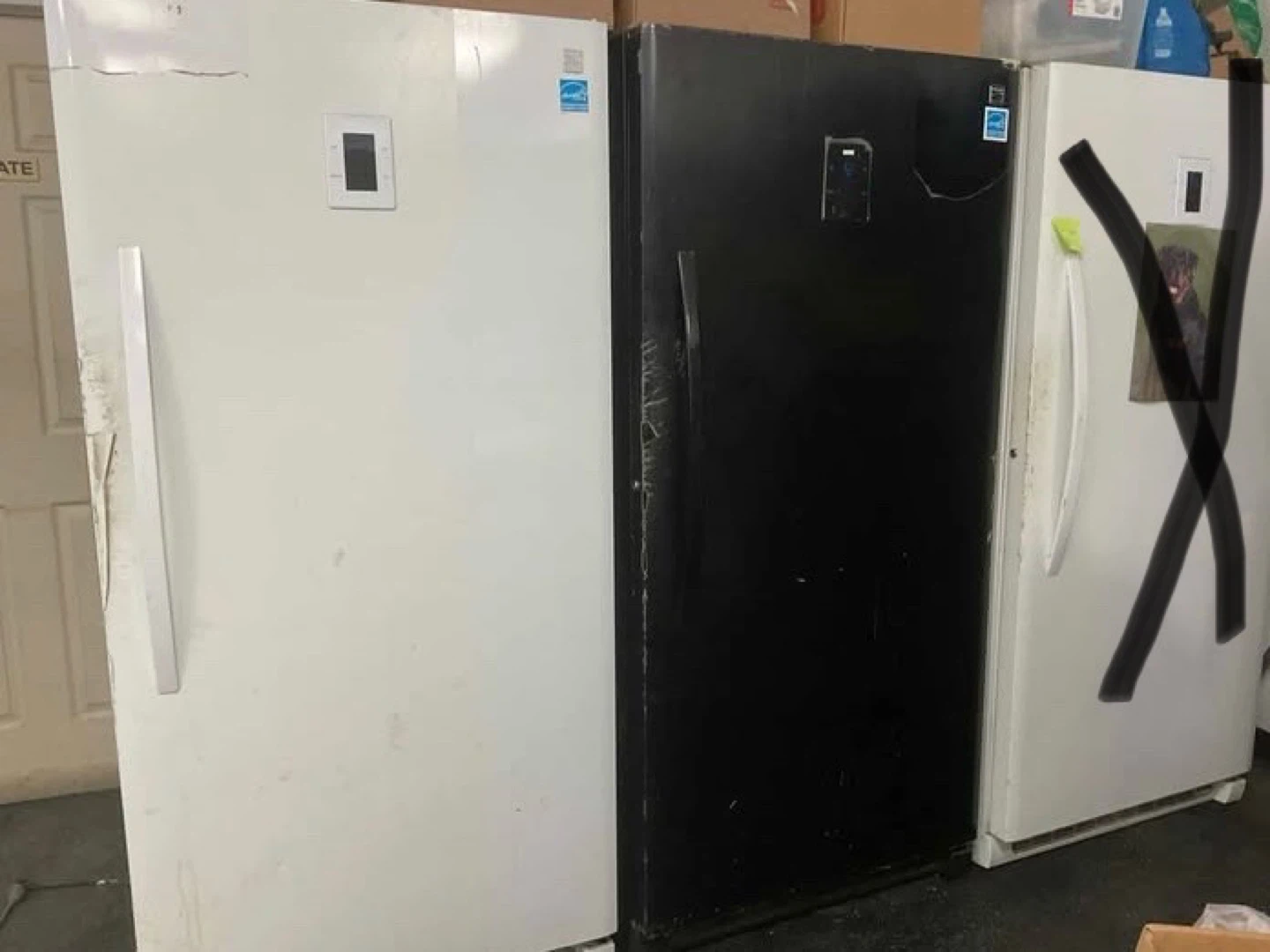 2 standing freezers  black & White