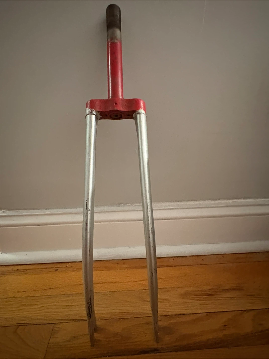 Red and Silver Bicycle Fork