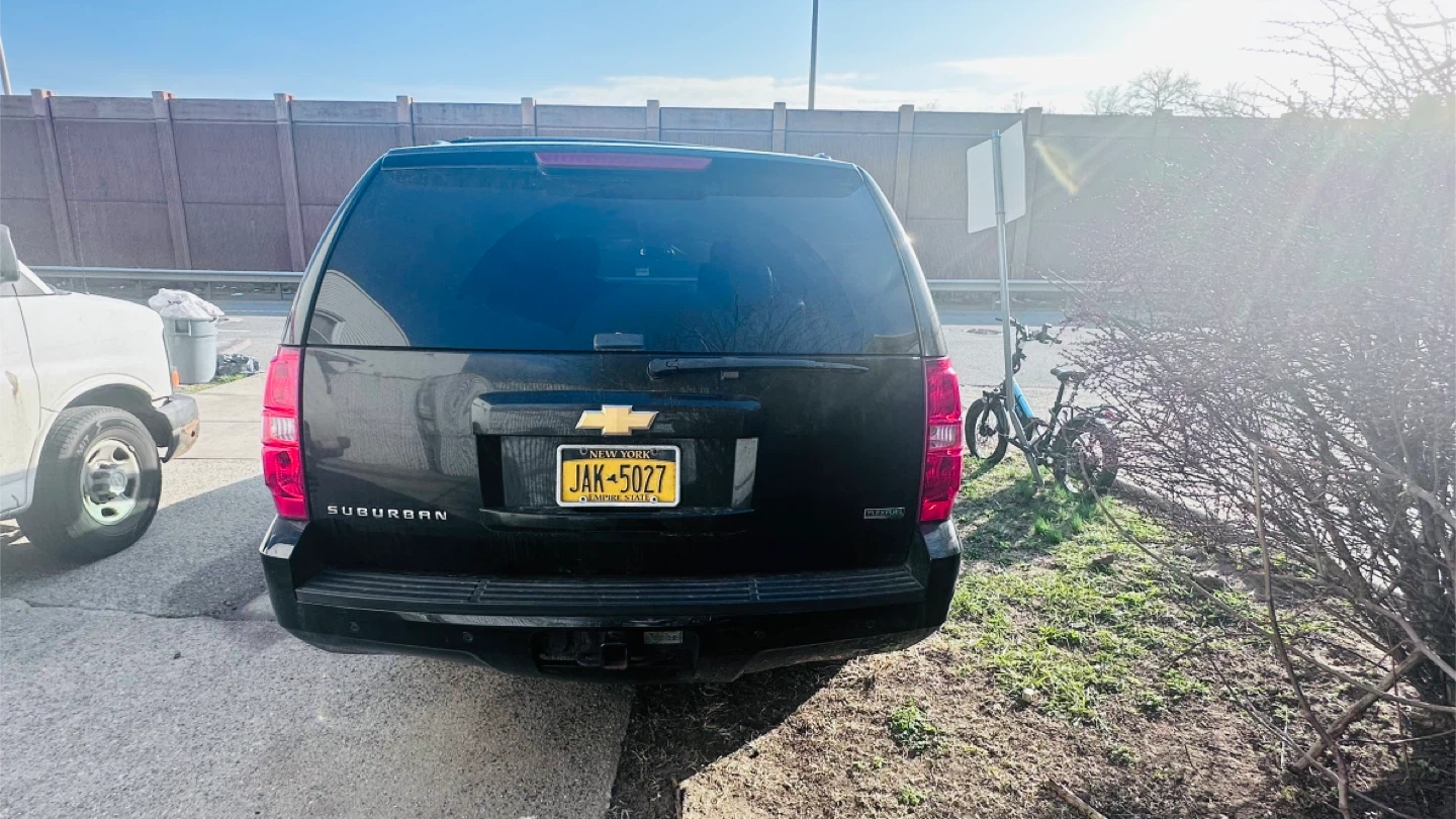 Black Chevrolet Suburban SUV - photo 3