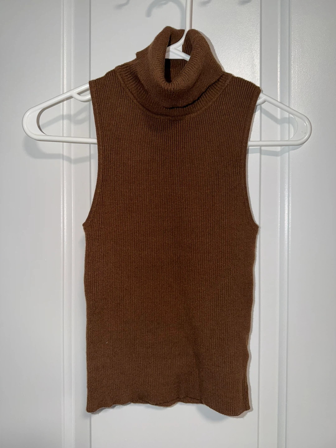 Brown sleeveless turtleneck top