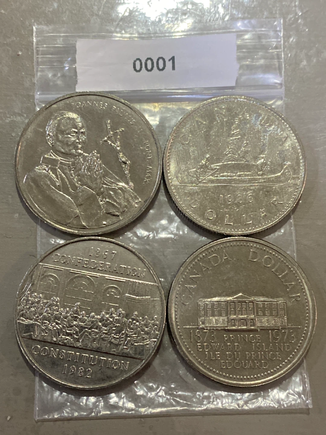 Collection of Four Canadian Dollar Coins - photo 2