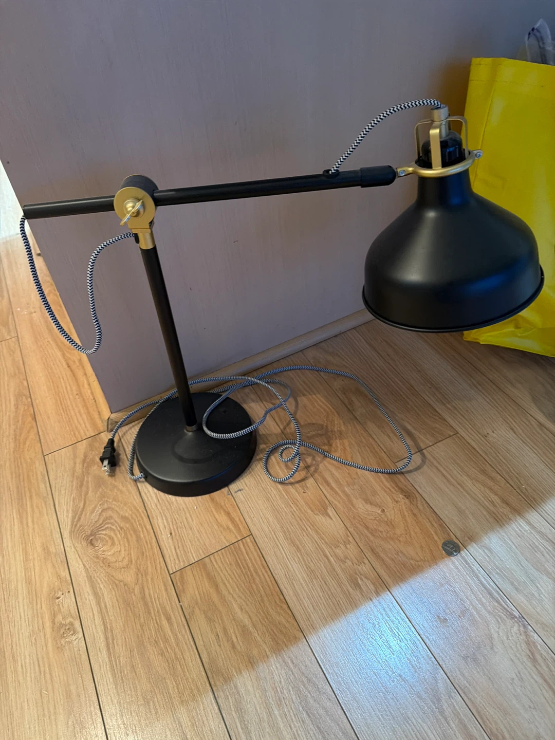 Black adjustable desk lamp with brass accents