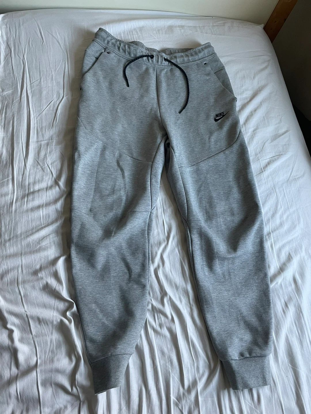 Grey Nike tech pants