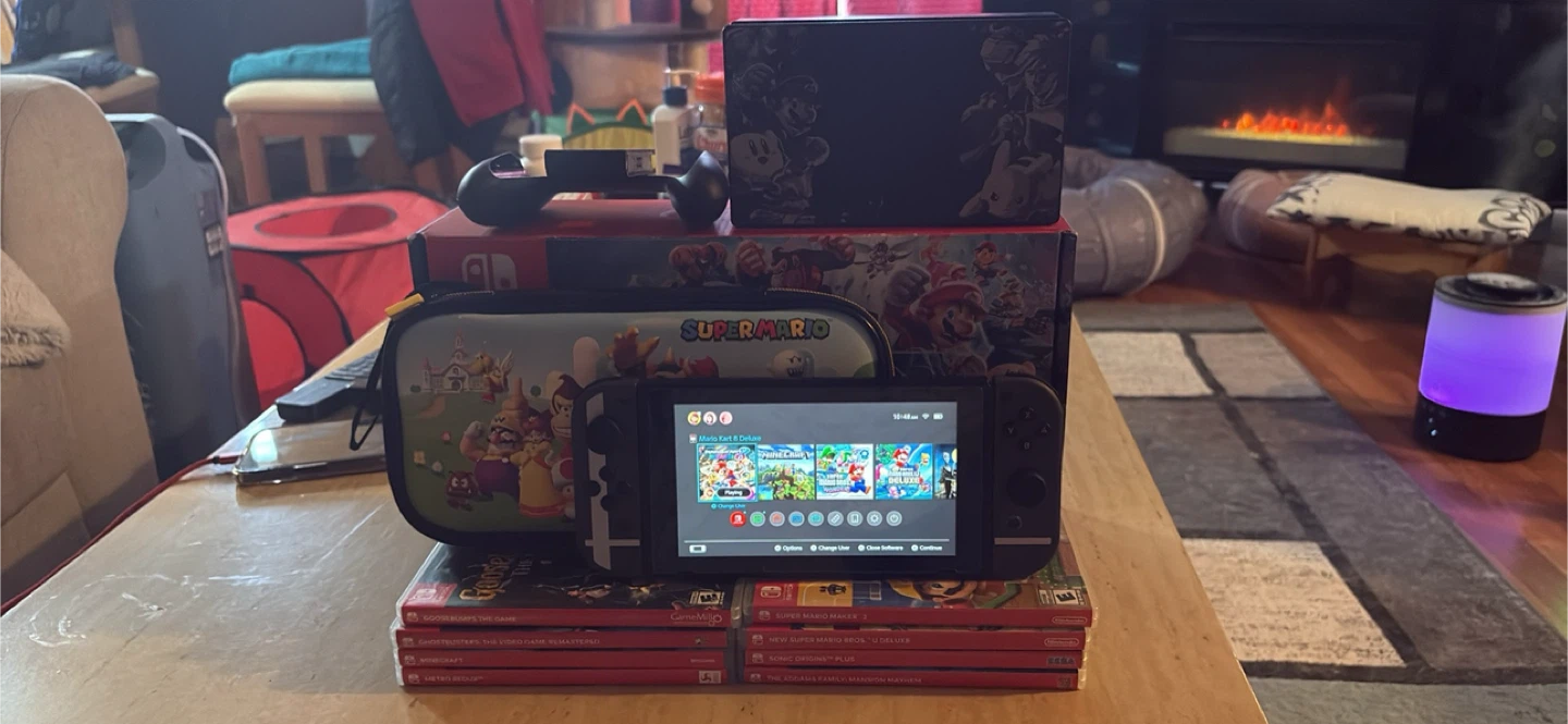 Nintendo Switch Console + 9 games + travelling case
