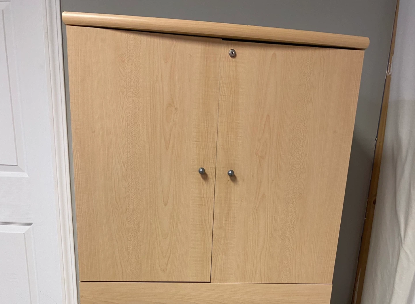 Light Wood Two-Door Cabinet with Shelves