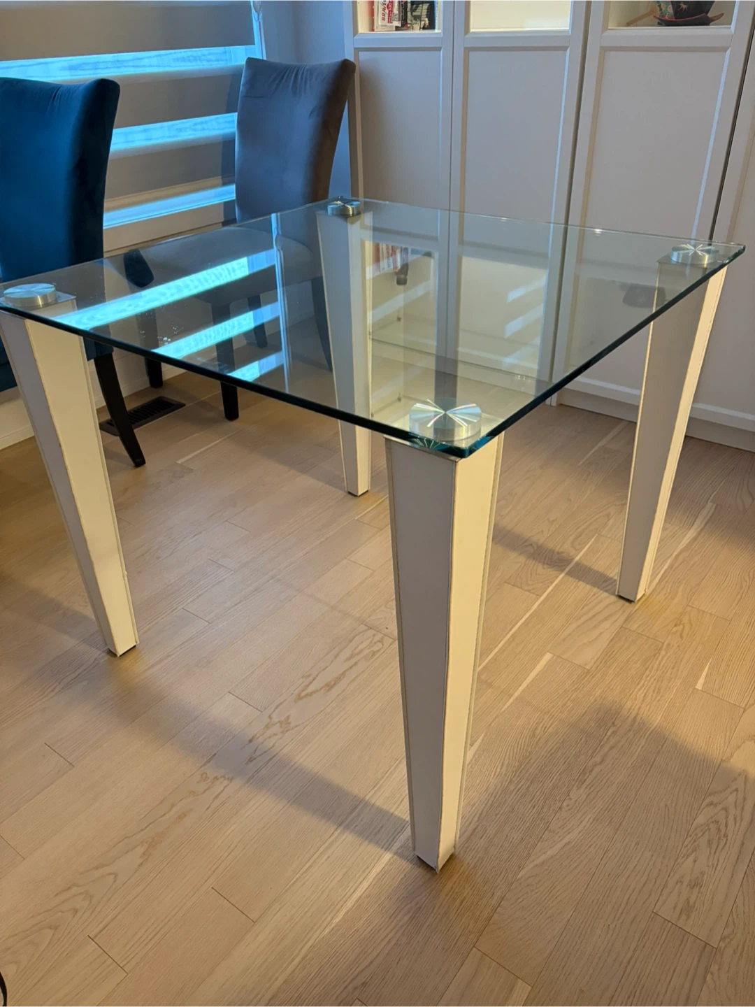 Glass top side table with white legs