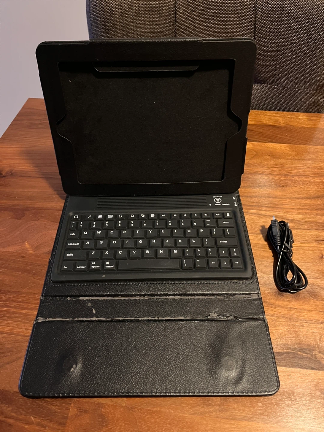 Black Tablet Case with Keyboard and Charging Cable
