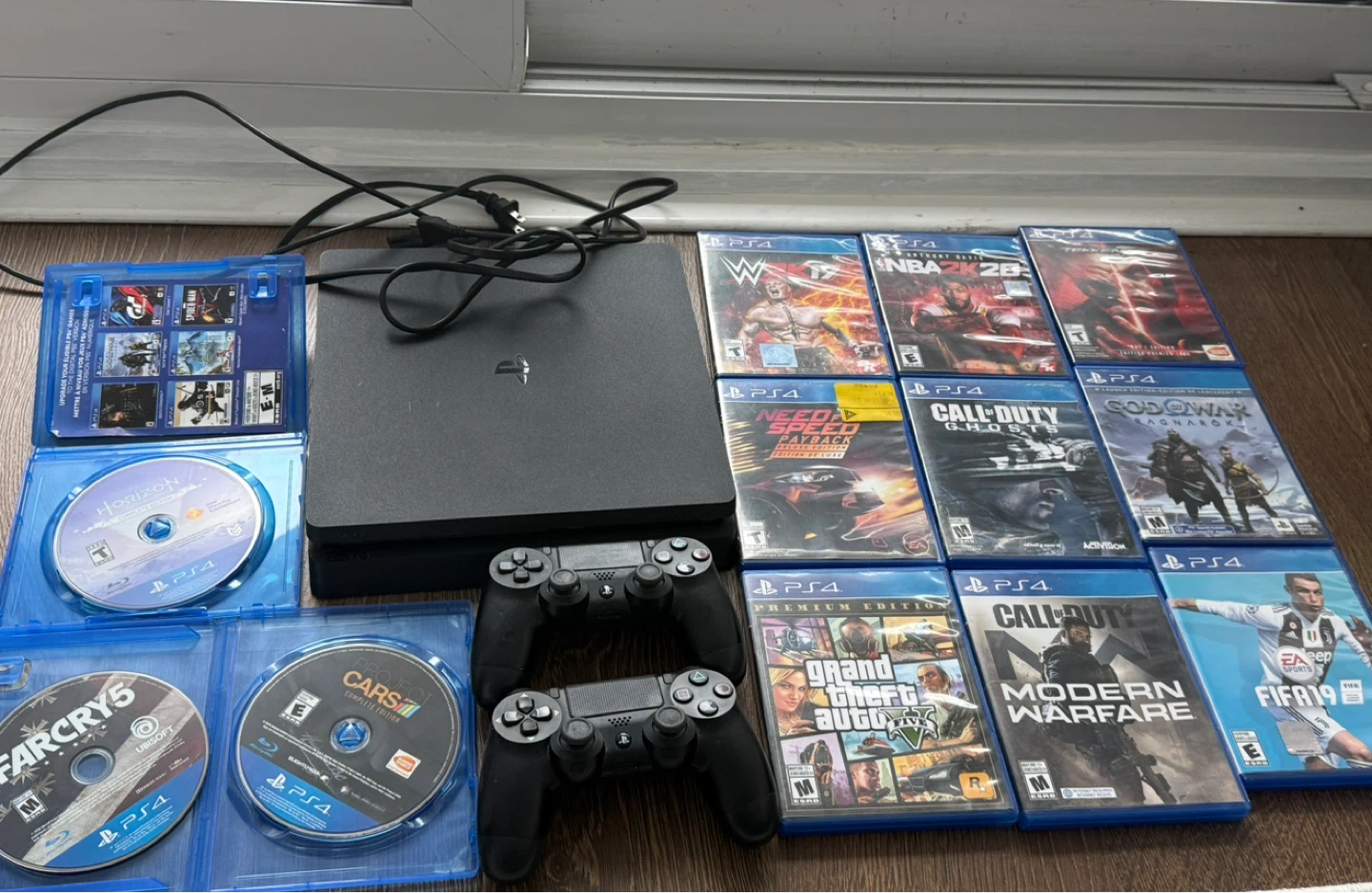 Sony PlayStation 4 Slim Console with Games and Controllers