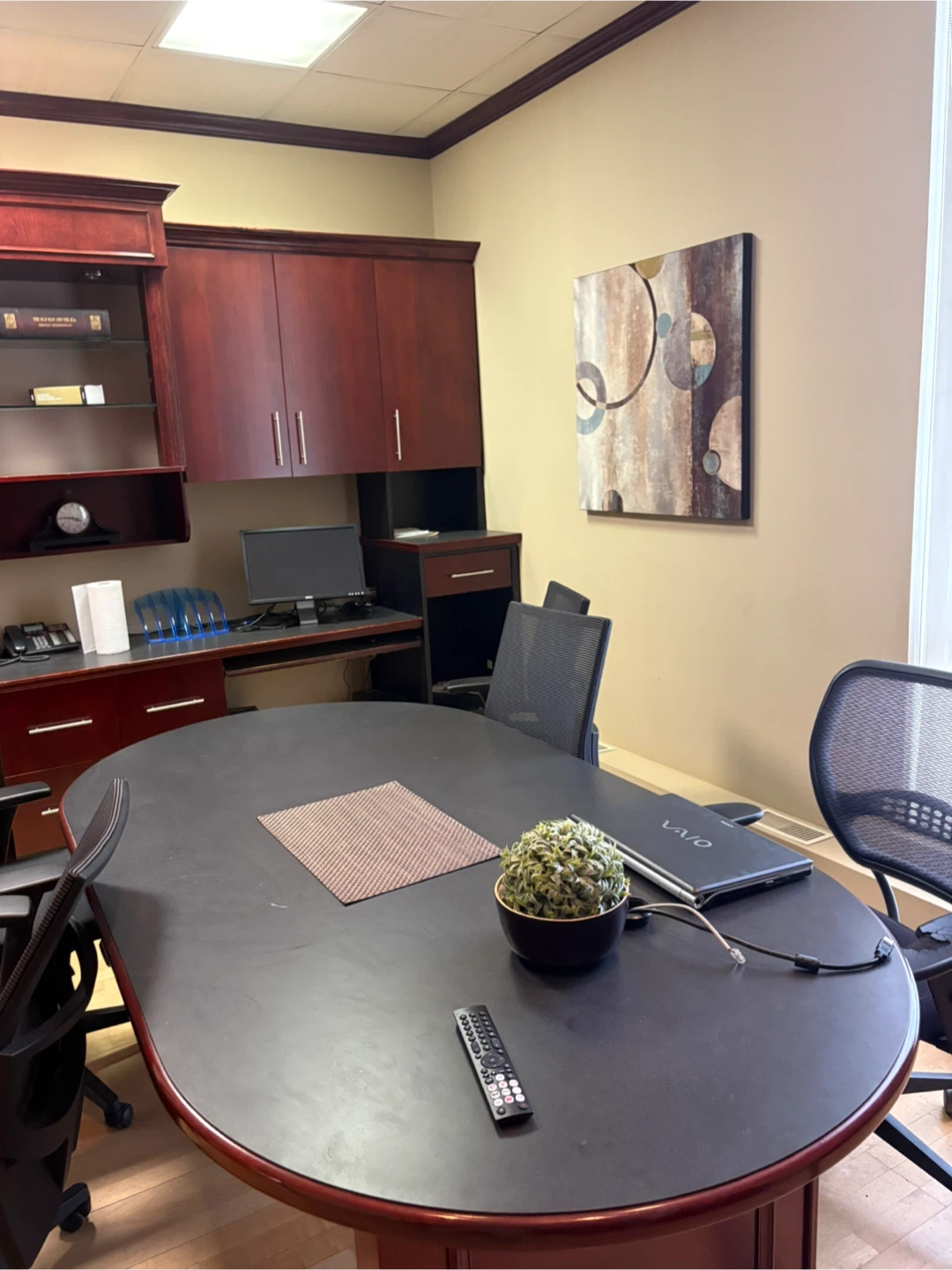 Large office desk with built-in cabinets and hutch