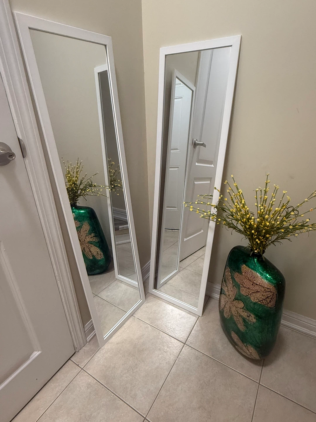 Two Tall White Framed Mirrors