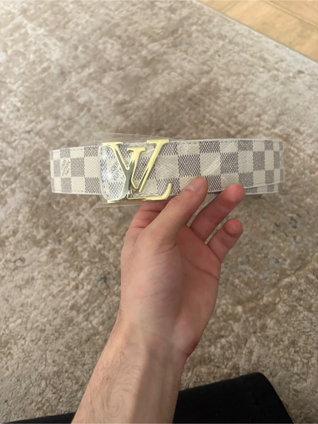 White and gold lv belt