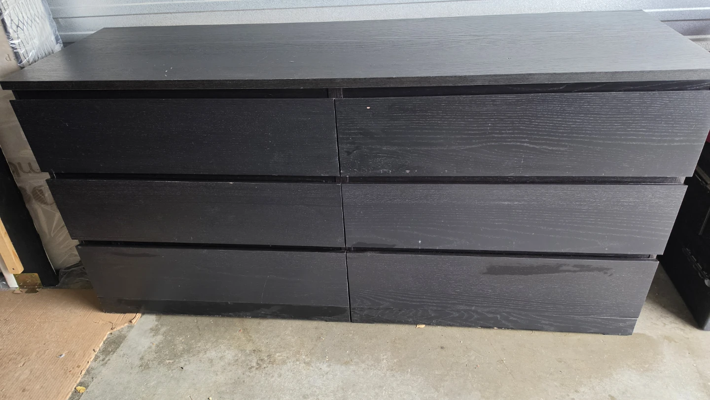 IKEA MALM 6-drawer chest in a black-brown finish. 