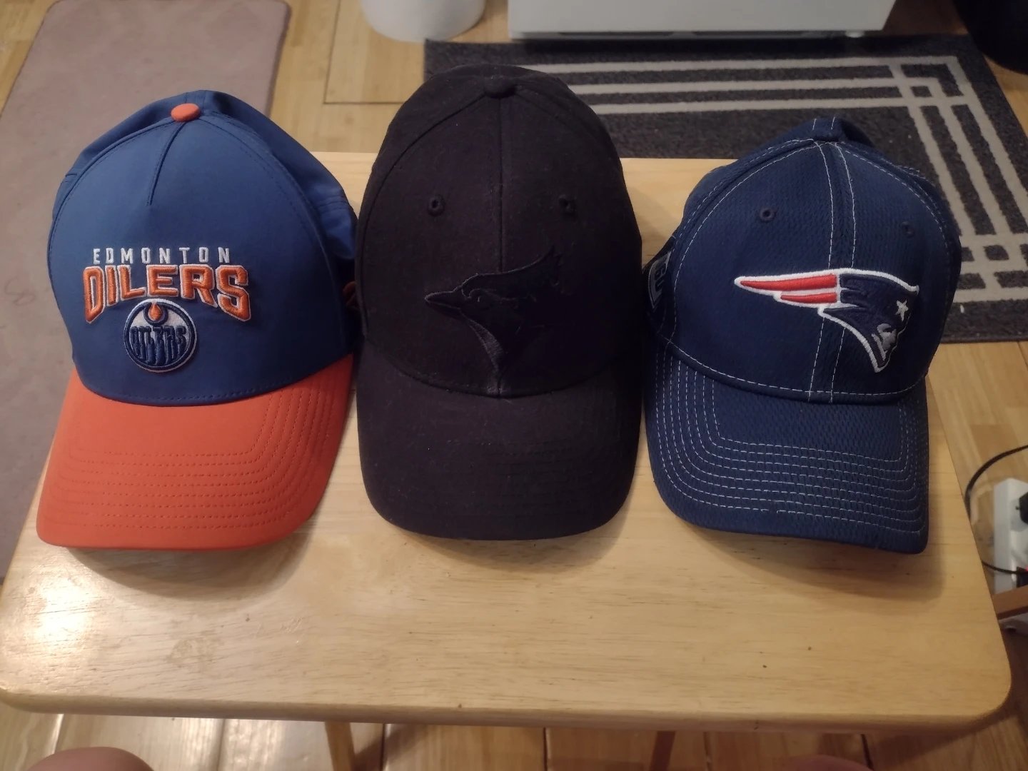 Assorted NHL & NFL Baseball Caps