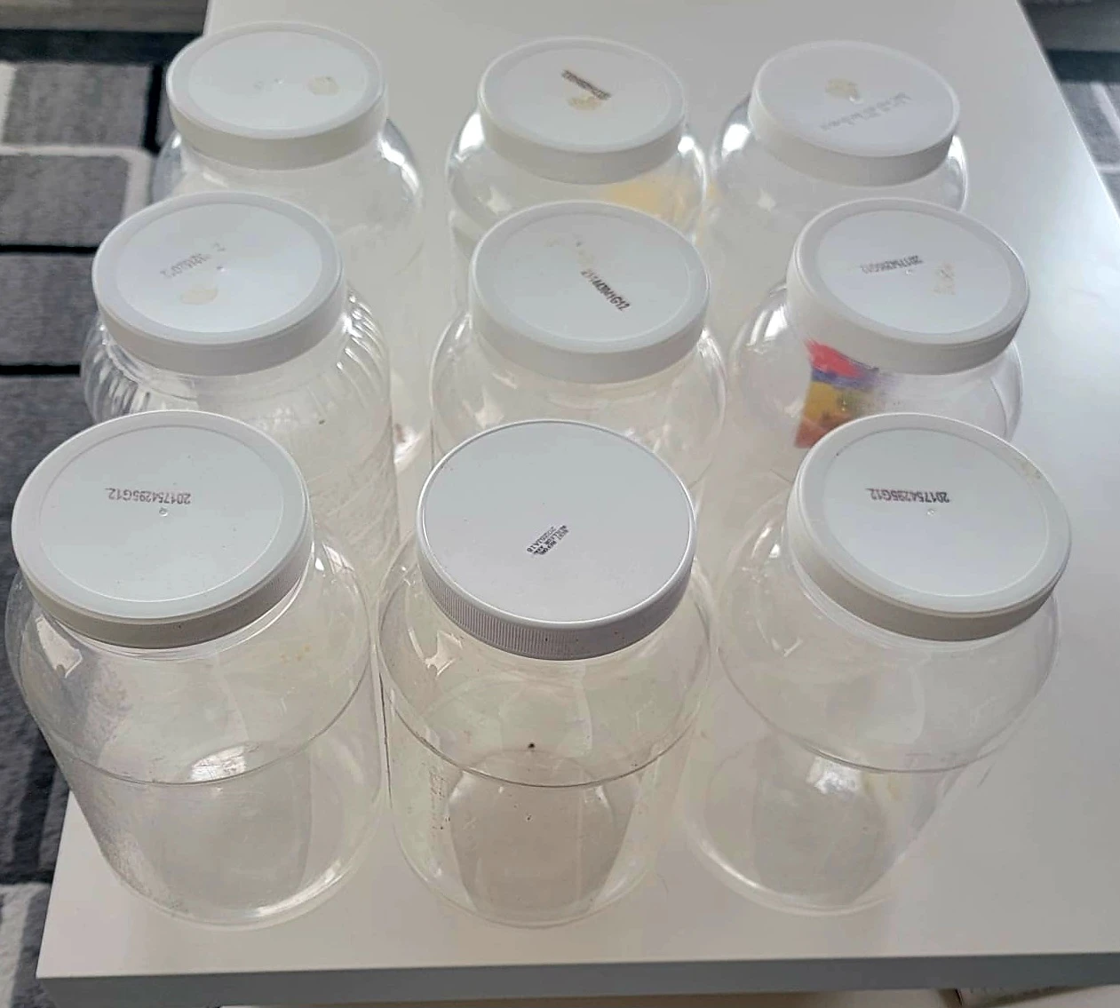 9 x Clear Plastic Storage Jars with White Lids