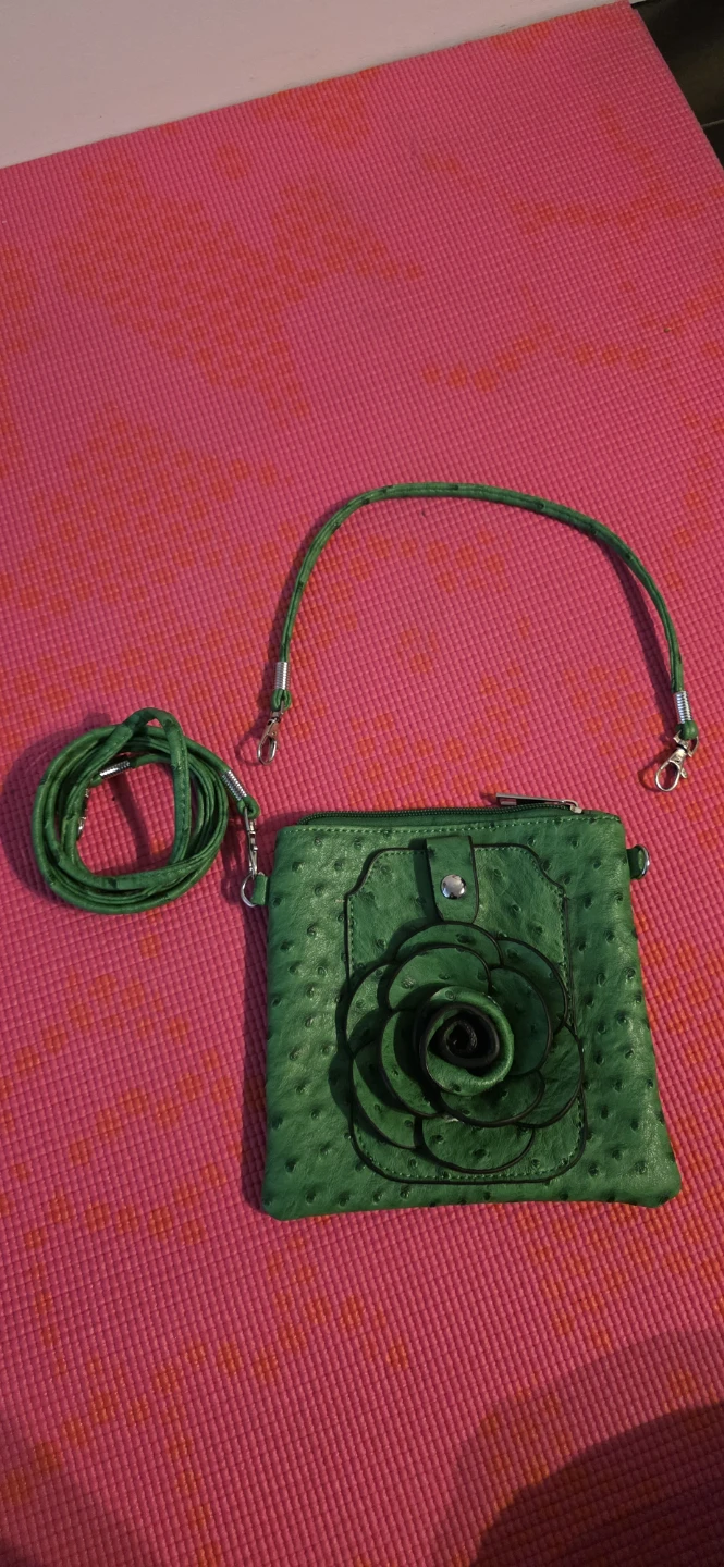 Green cross-body bag with flower accent