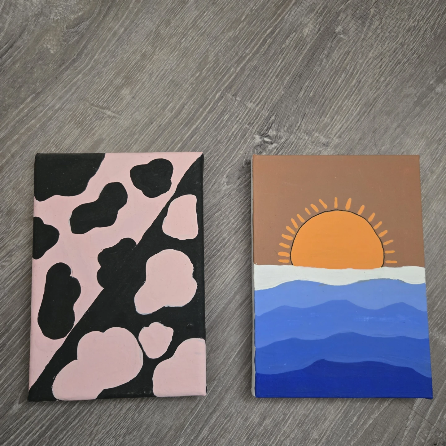 Two Small Canvas Paintings: Cow Print and Sunset
