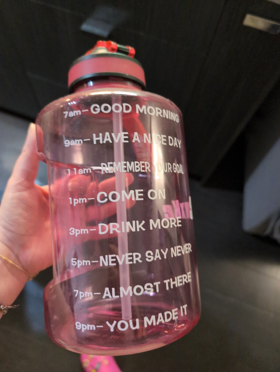 Large motivational water bottle with straw