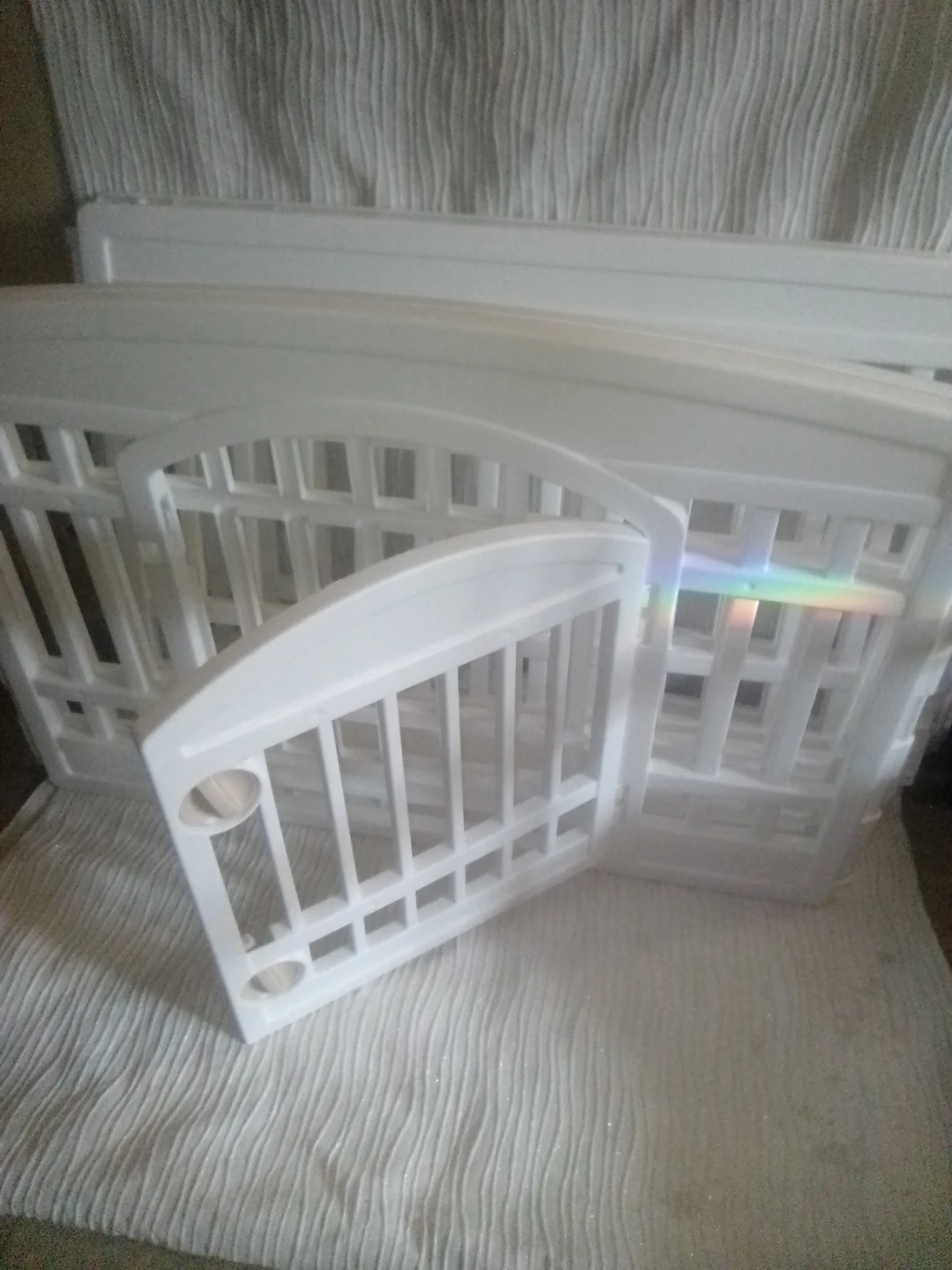 Small White Baby Crib Rails play area.
