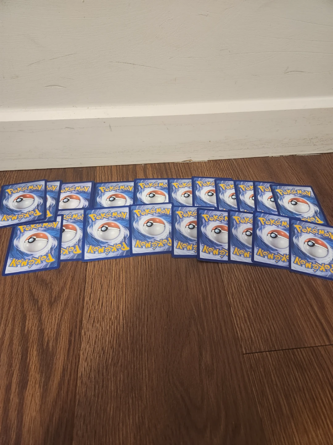 20 pokemon cards (1 v card, 1 holo, 18 normal cards