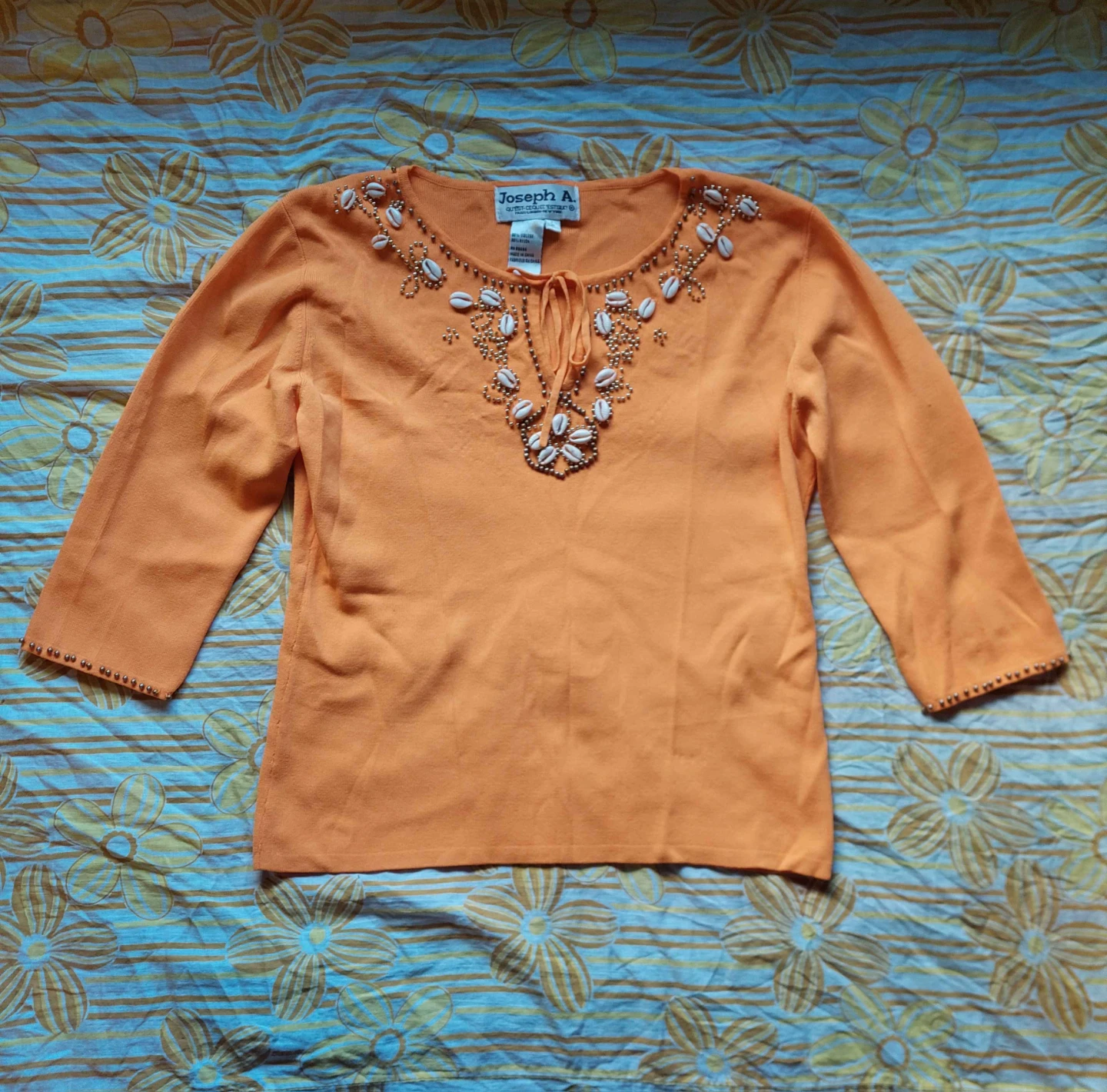 Orange beaded boho top with shells and bead trim