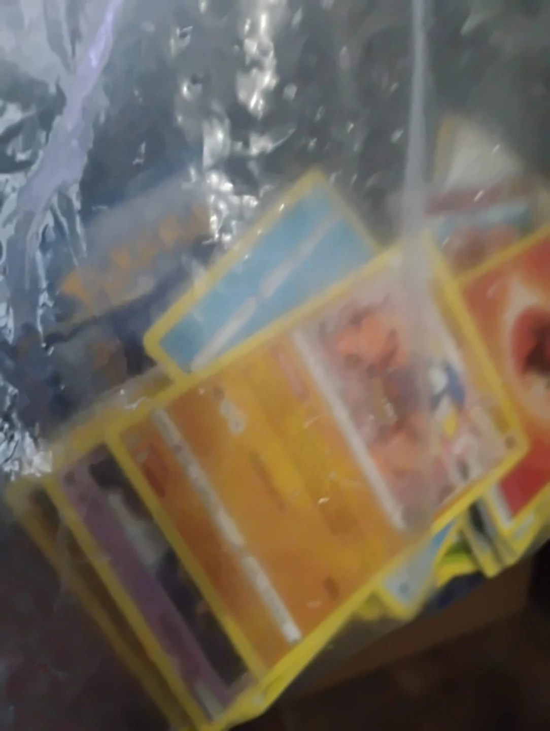 Bag of assorted toys including Pokémon cards and action figures