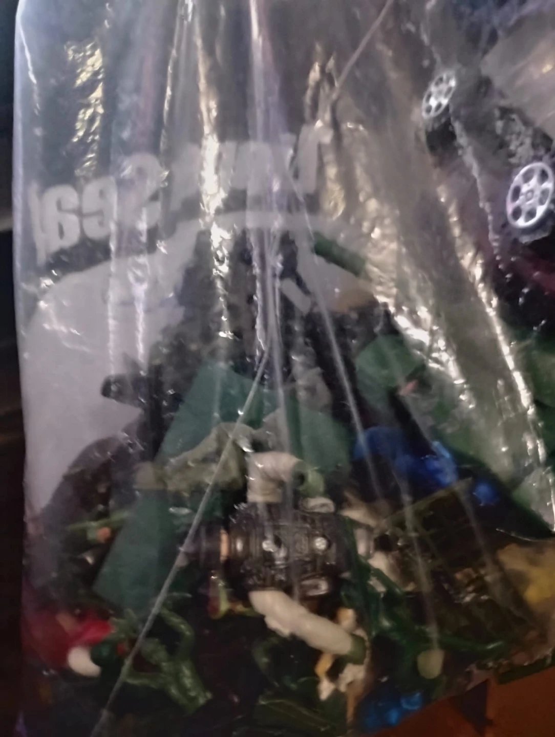 Bag of assorted toys including Pokémon cards and action figures - photo 2