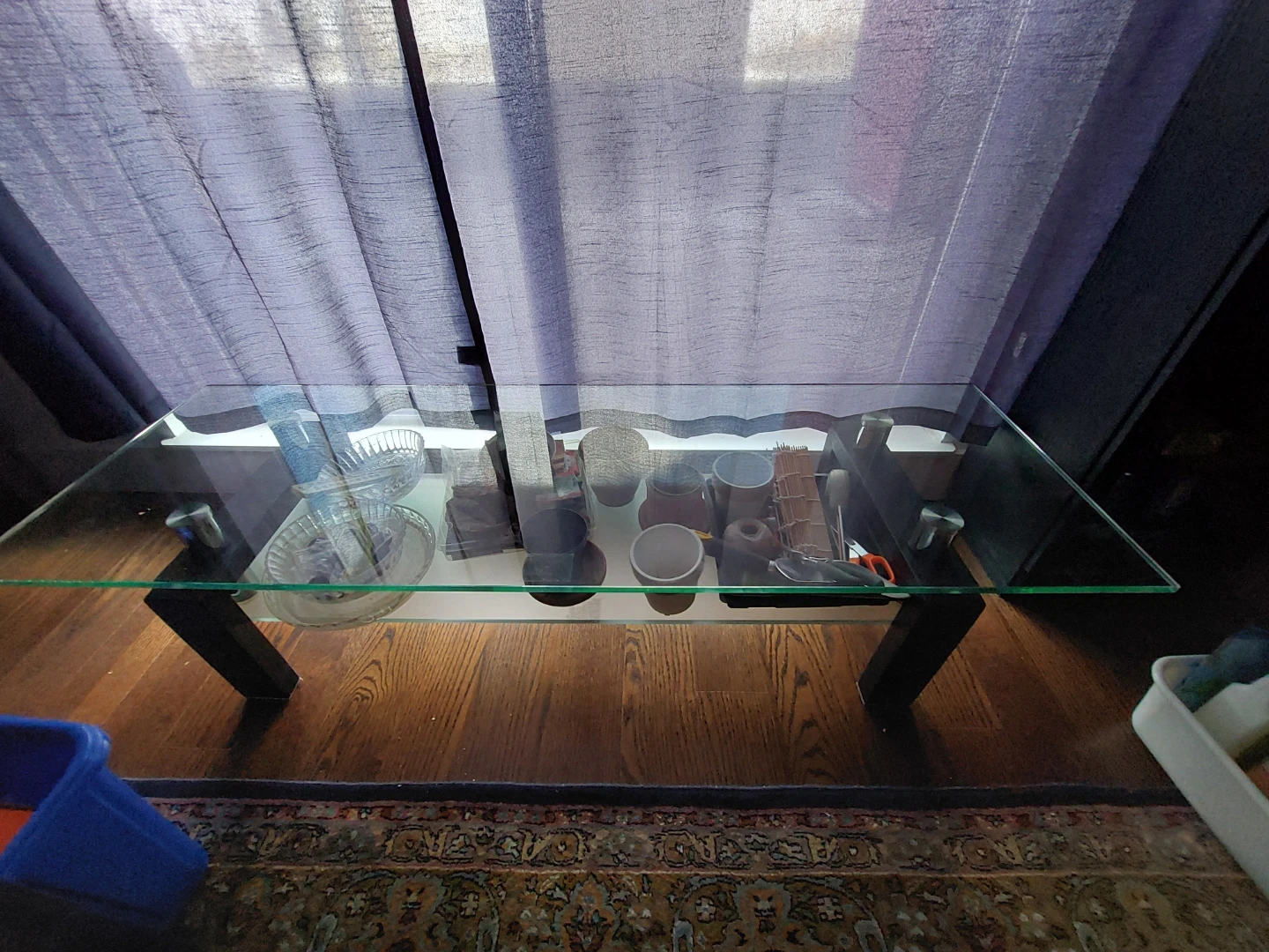 Glass top coffee table with black legs