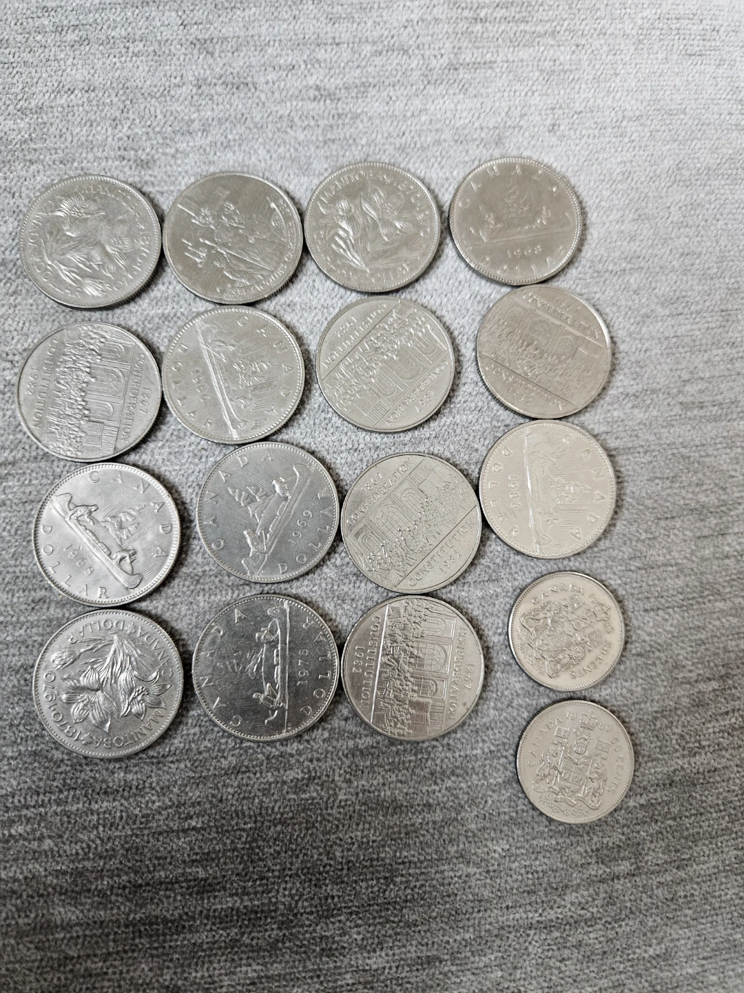 15 One dollar Canadian coins. 2 x 50 cent pieces