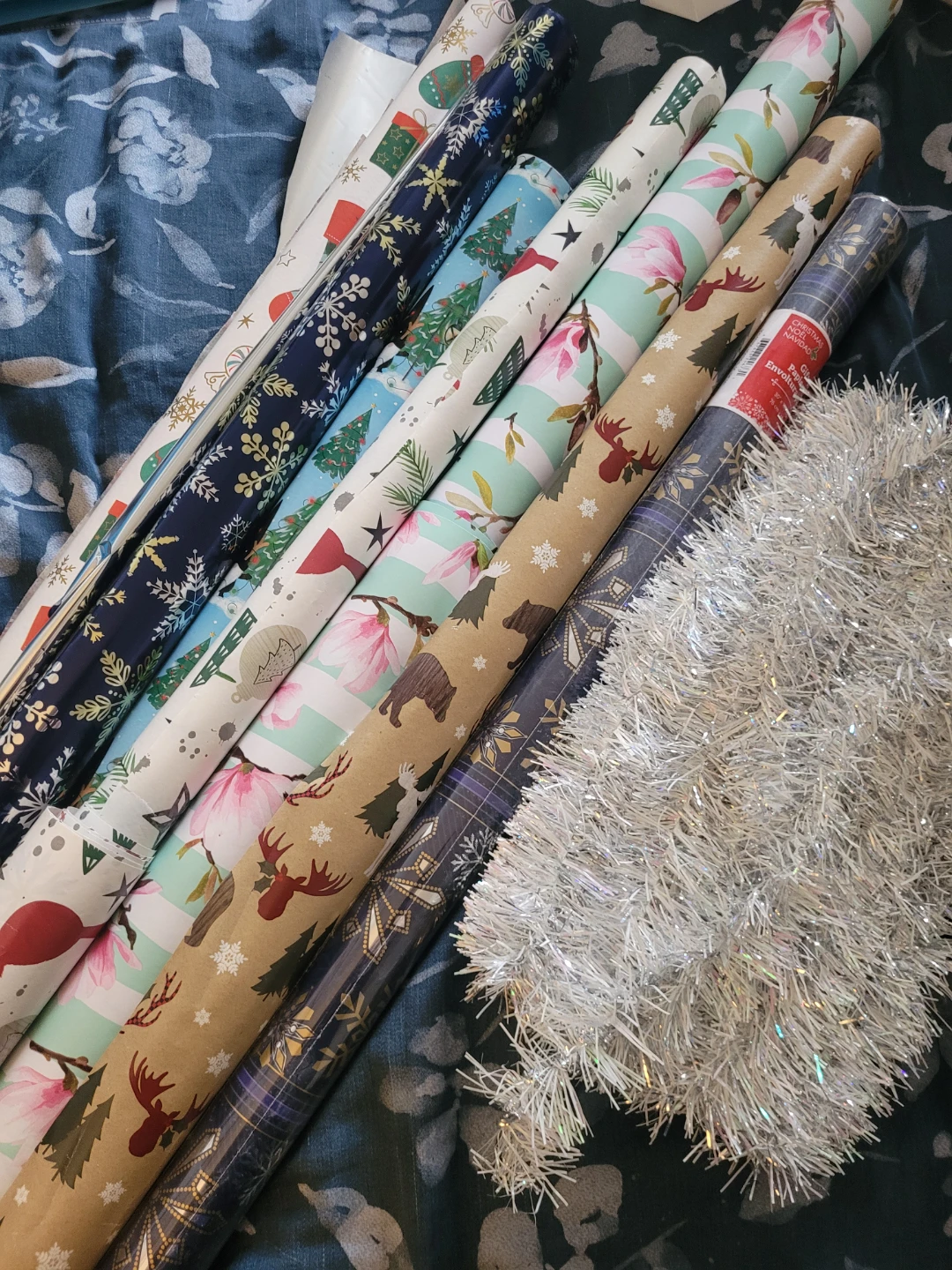 Bundle of Holiday Wrapping Paper and Silver Tinsel