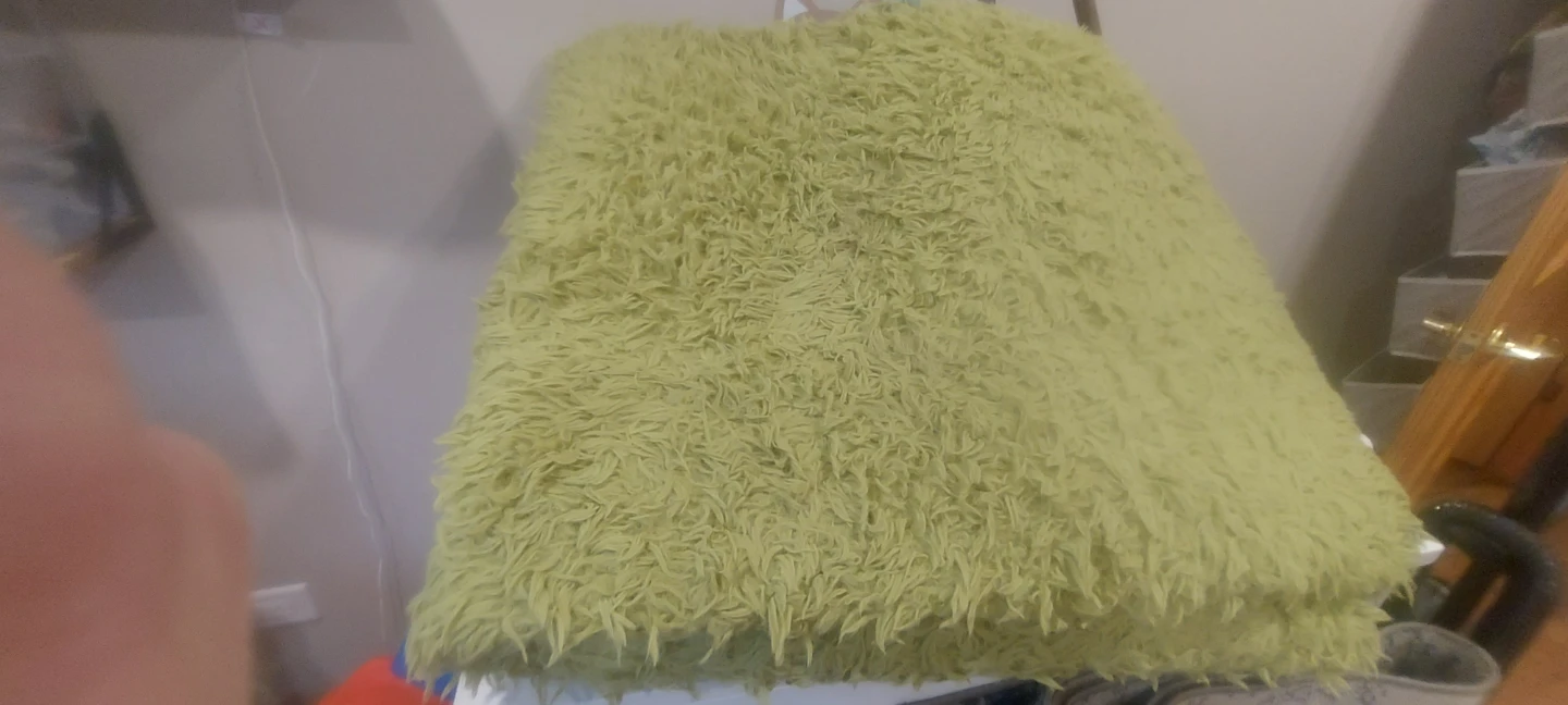 Light Green Shaggy Throw Blanket folded so much larger