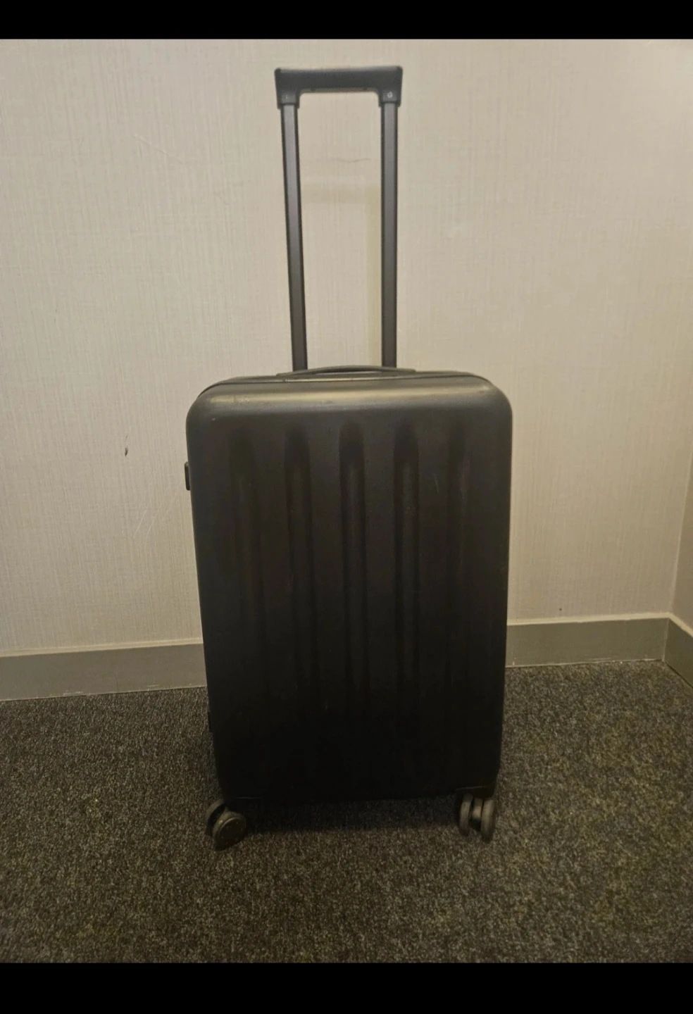 Black Xiaomi Mi 90 Point 20 inch hard-shell carry-on suitcase.