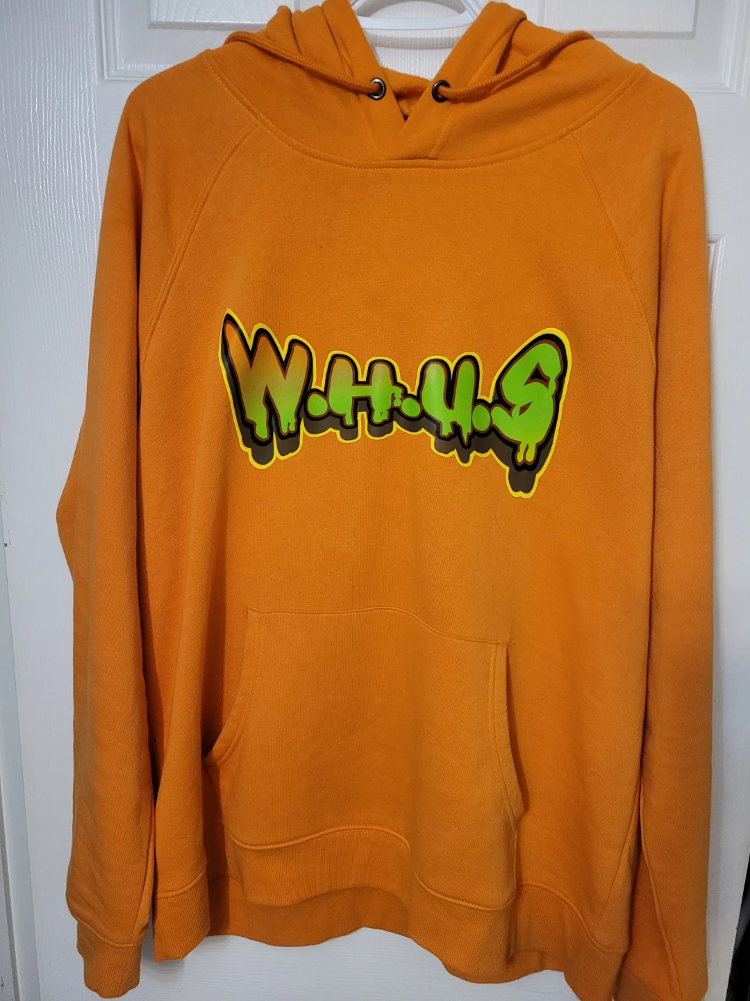 Toxickind Orange Hoodie with "W.H.U.S." Graphic