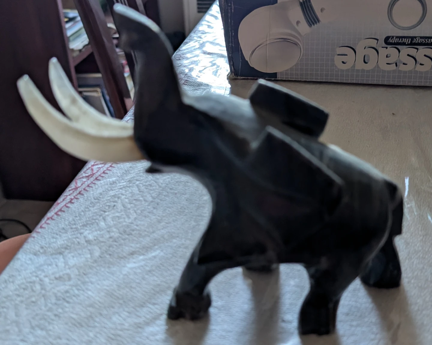 Carved Stone Elephant Figurine with Ivory Tusks