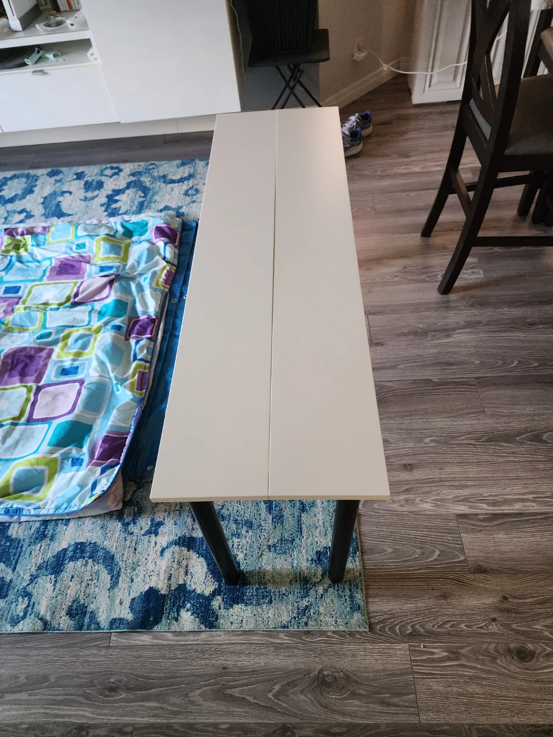 White narrow table with black legs